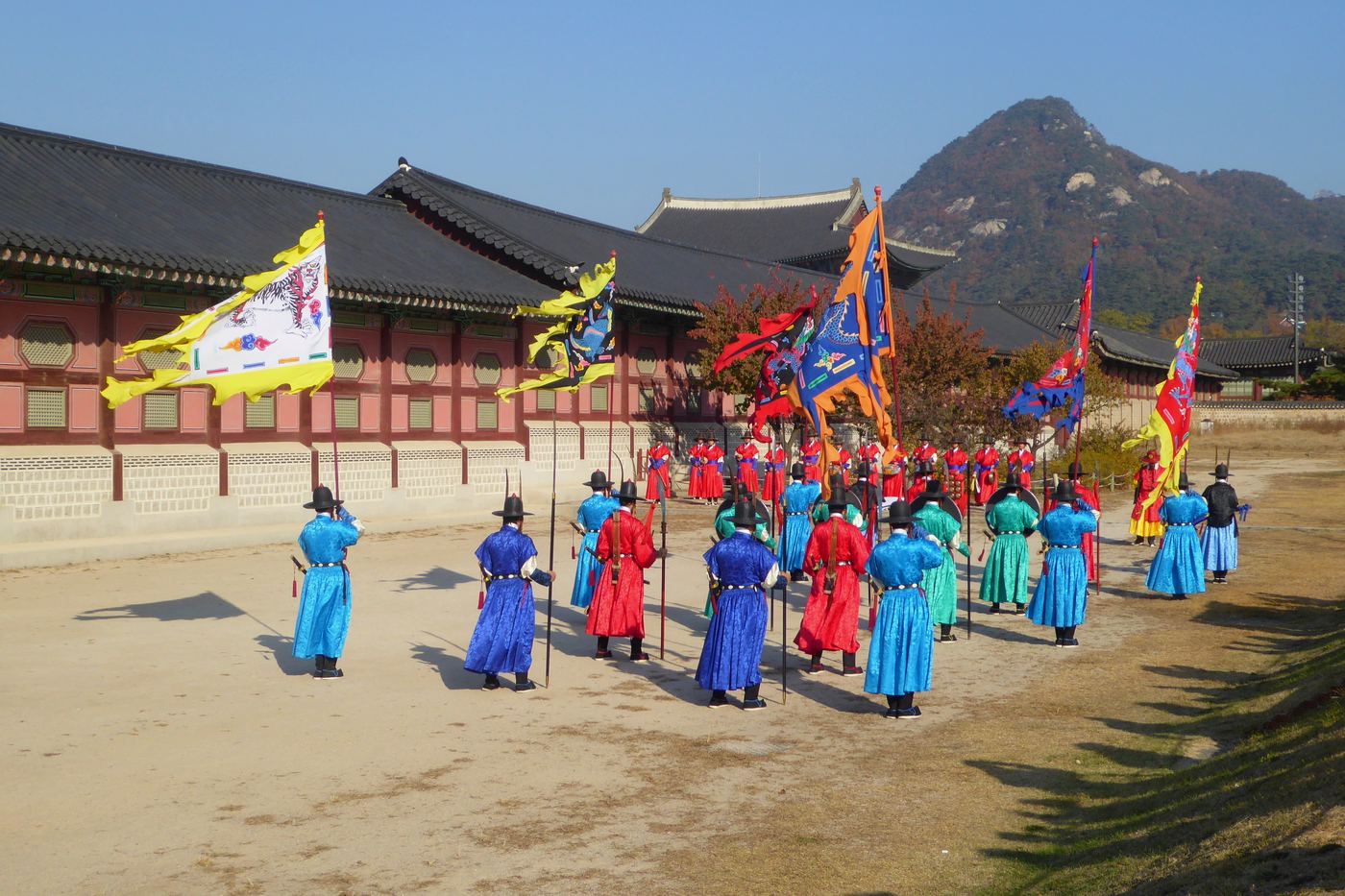 The changing of the guard ceremony at Gyeongbokgung, in blue and red robes